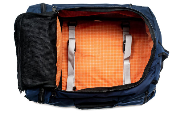An open Techonaut 45 with a Deep Blue (dark blue) exterior and a Zest (orange) interior.